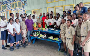 IHS Alumni donates a Fridge and a quantity of spikes (athletic shoes)