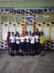IHS Alumni Association members recognizing the medal winners from the Inter Secondary School Athletes final